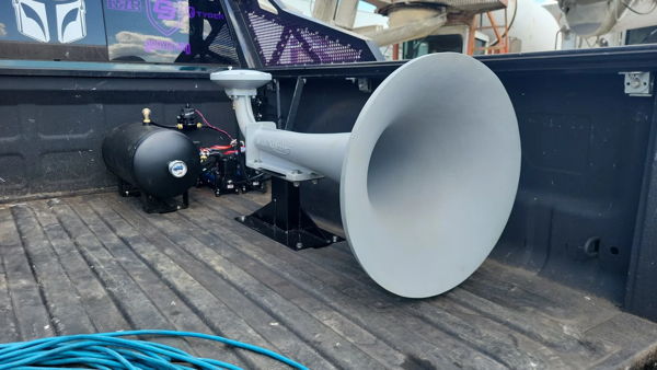 Large Kahlenberg air horn with air tank and compressor mounted in Ram pickup truck bed