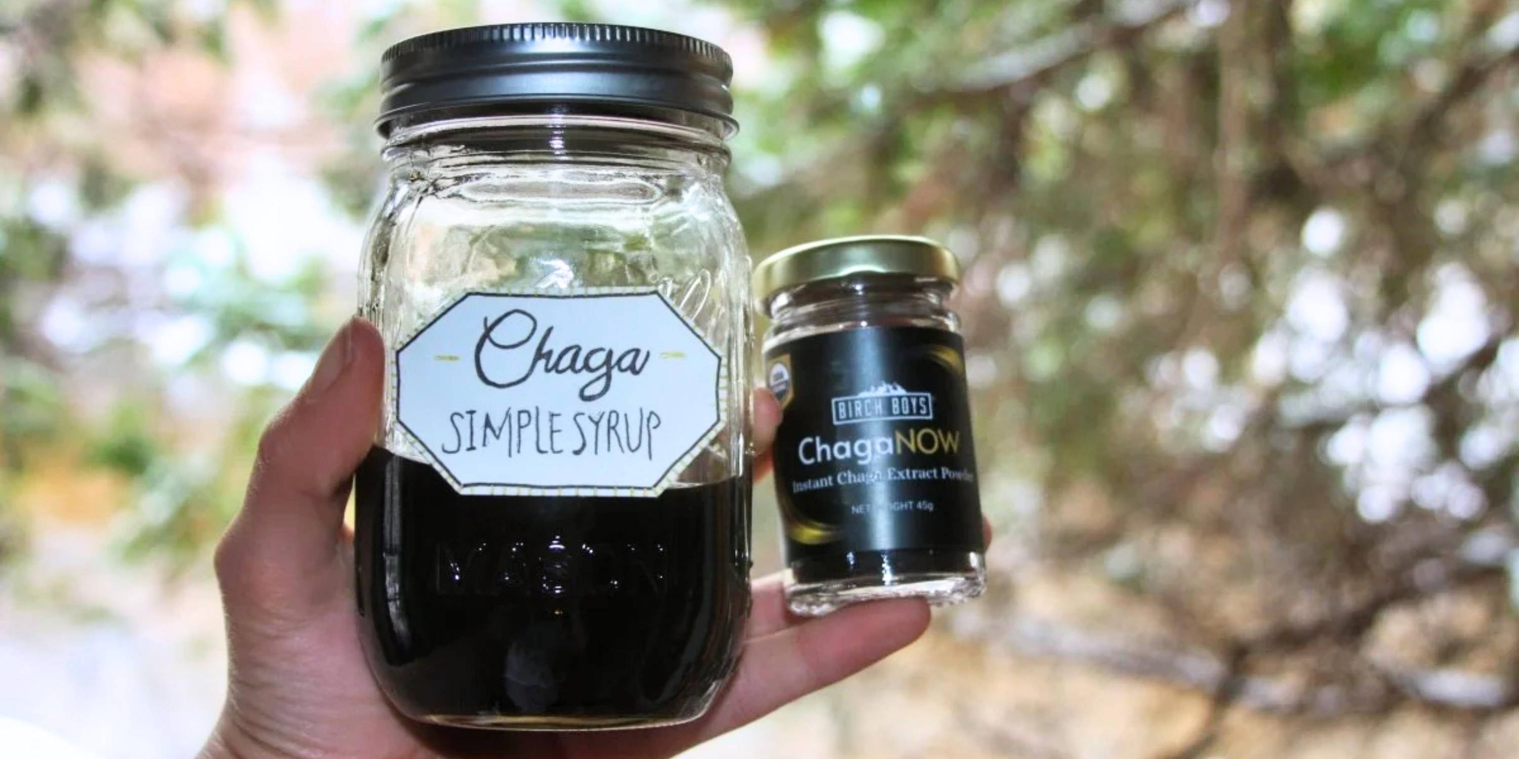 Chaga simple syrup in a mason jar next to ChagaNOW instant chaga extract powder