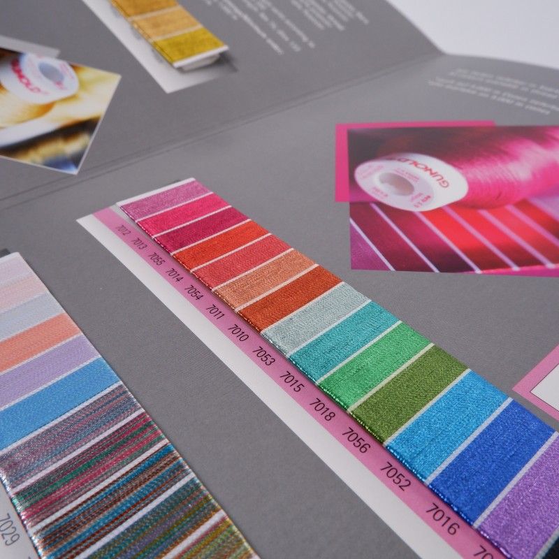 Sample cards showing specialty embroidery threads incuding gradient blends, metallic finishes and bright neon colours