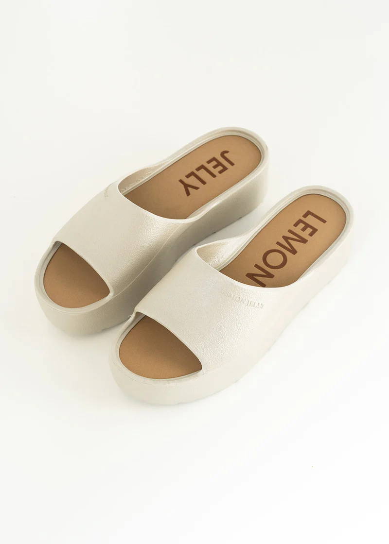 A pair of off white chunky platform slides