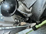 Close-up view of black HornBlasters Shocker XL horn mounted to vehicle undercarriage