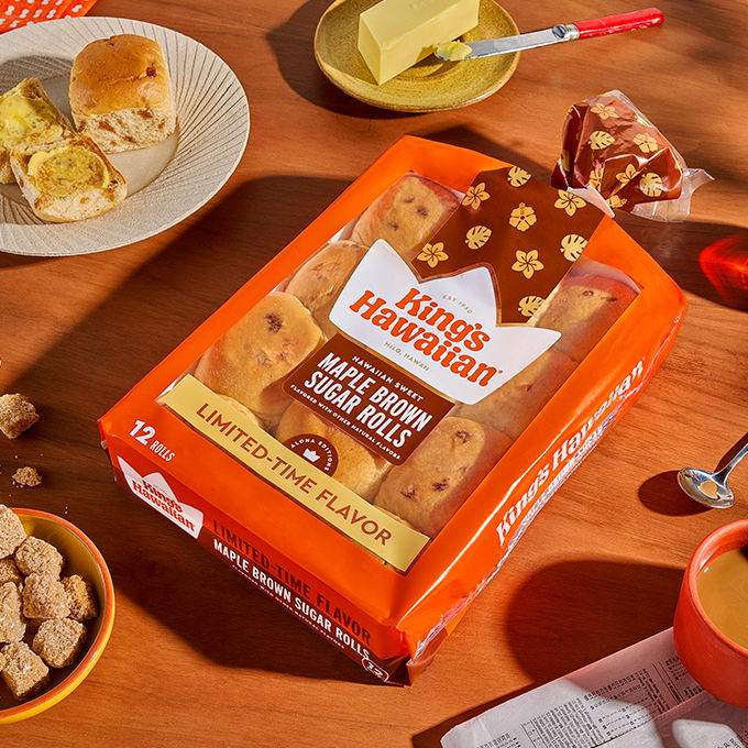 Kirkland Hawaiian cookie packaging on a wooden table with snacks.