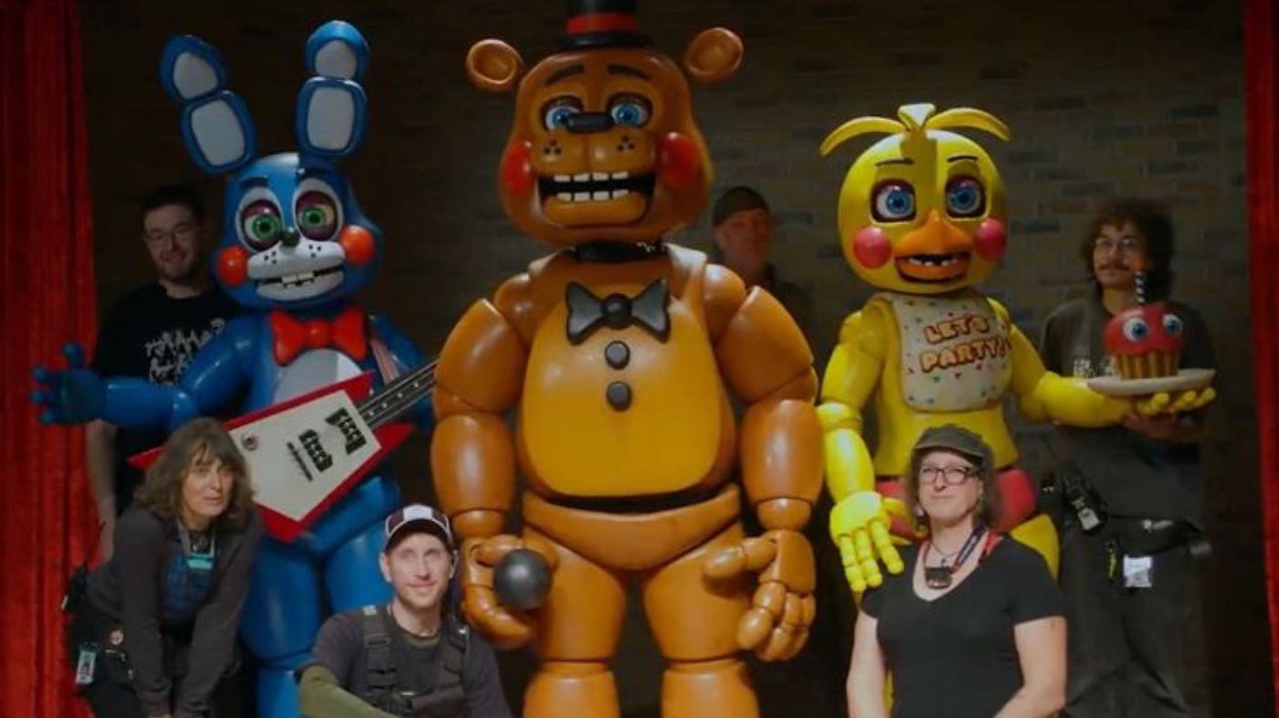 Three animatronic characters from Five Nights at Freddy’s featuring Freddy Fazbear Bonnie the Bunny and Chica the Chicken standing together in eerie horror game style