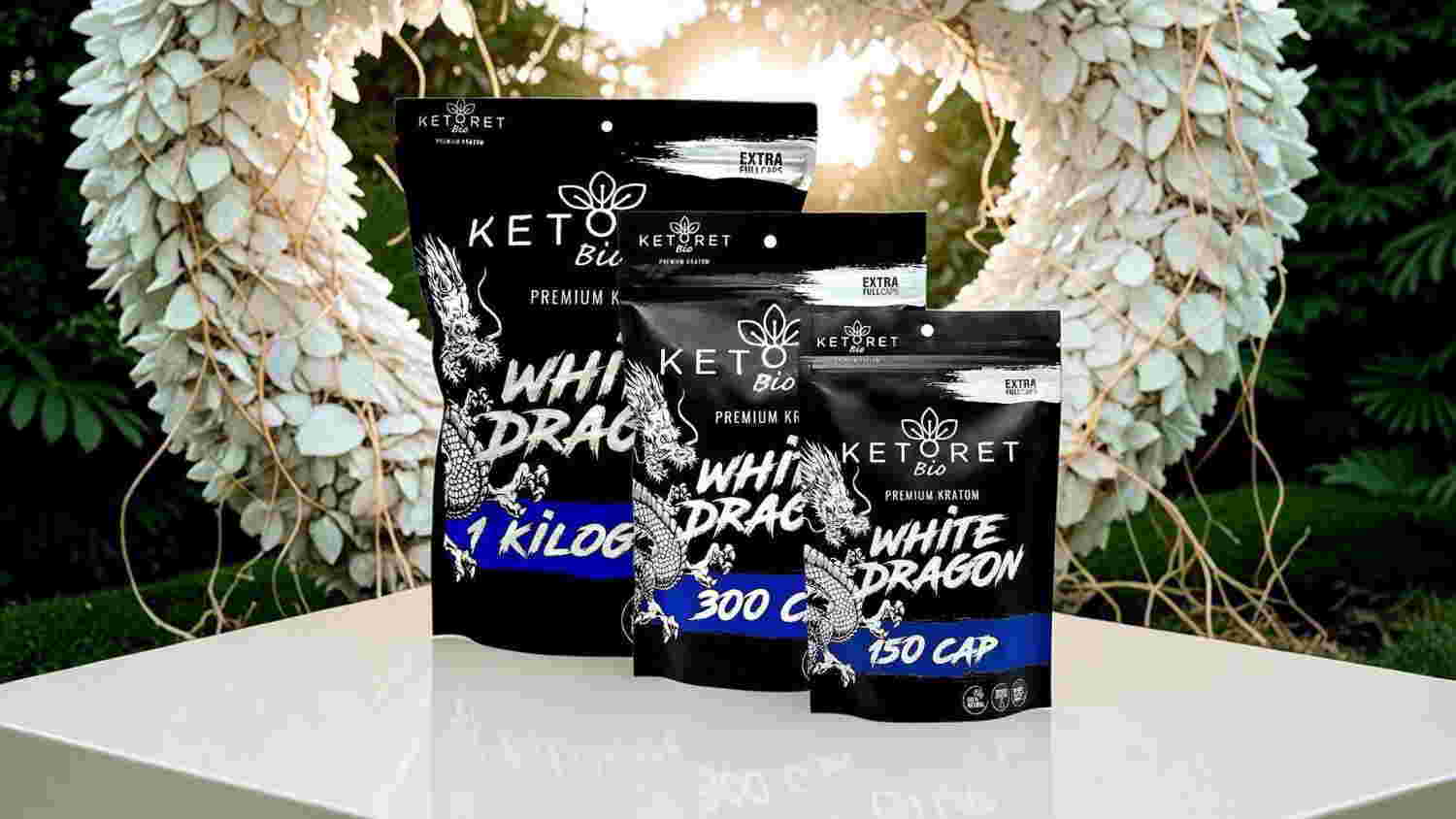Three keto product packages displayed on a table with a decorative background.