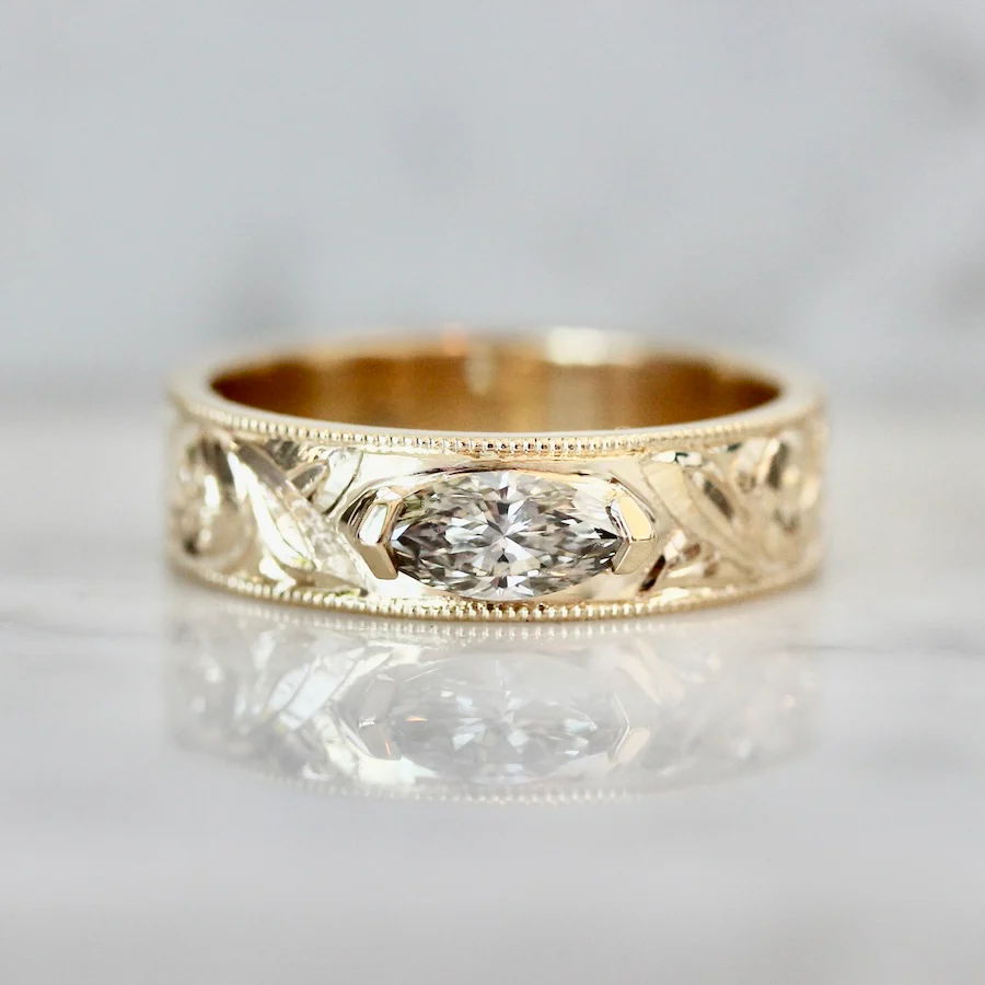 Hand-engraved wedding band with champagne marquise diamond set east-west