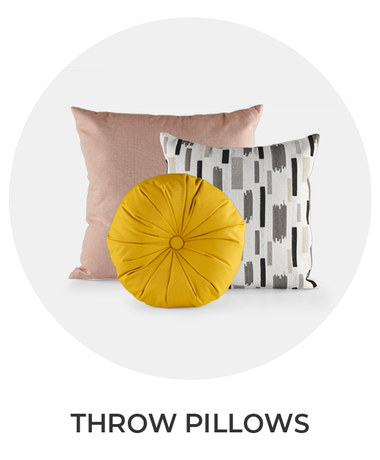 Three decorative throw pillows in various colors and patterns.