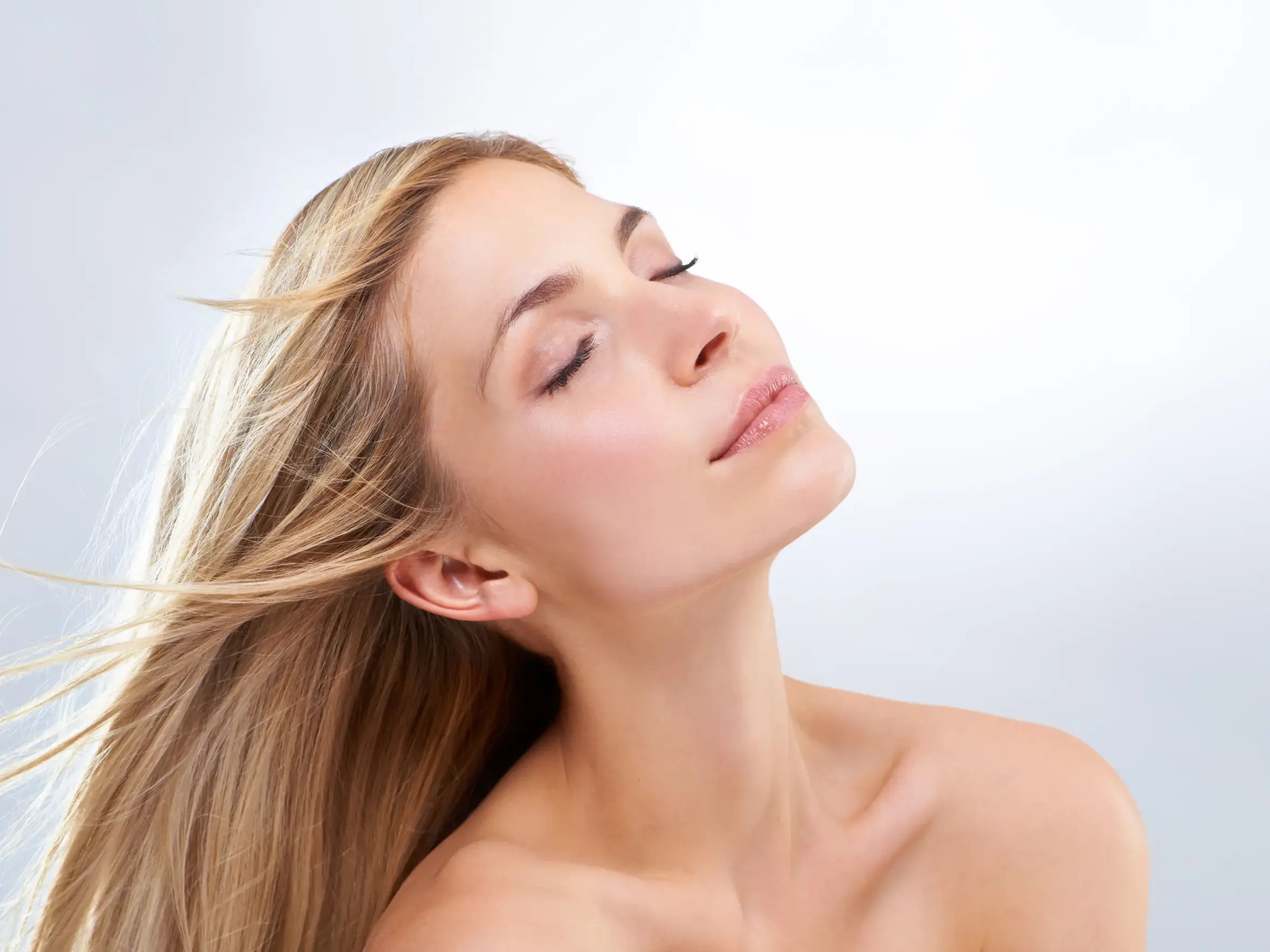 Woman receiving a facial aesthetic treatment at The Clim Clinic