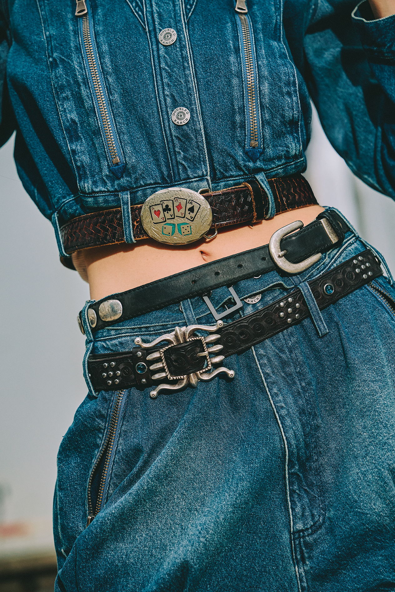 Detail shot of the Spur Line Jacket and Short paired with vintage Double D Ranch Belts.