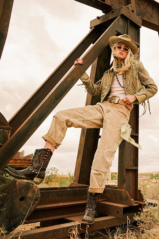 Haley wearing the Last Paycheck Jacket with vintage Carhartts, the Bit Boss Boots, and Double D Ranch jewelry and accessoreies.
