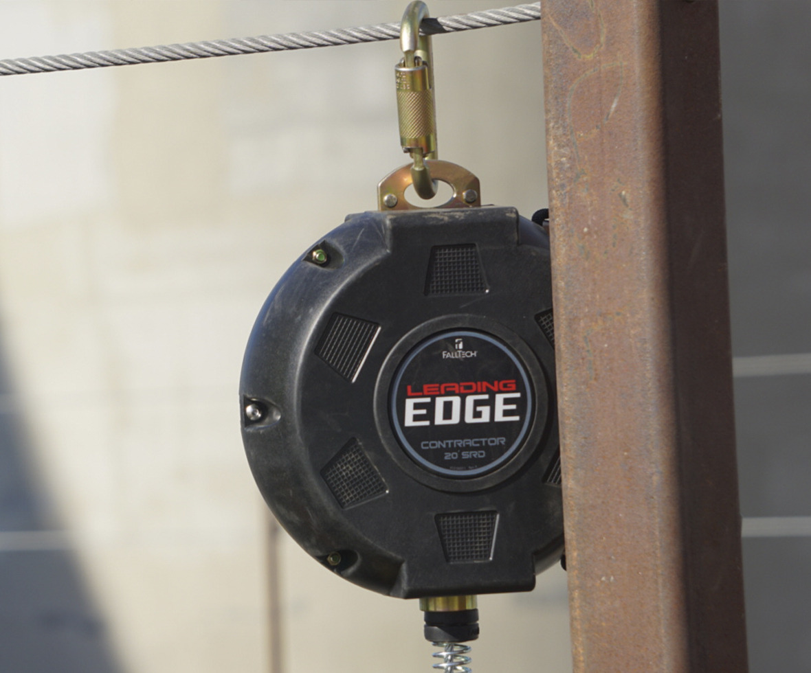 Contractor leading edge self-retracting lifeline block hanging at jobsite