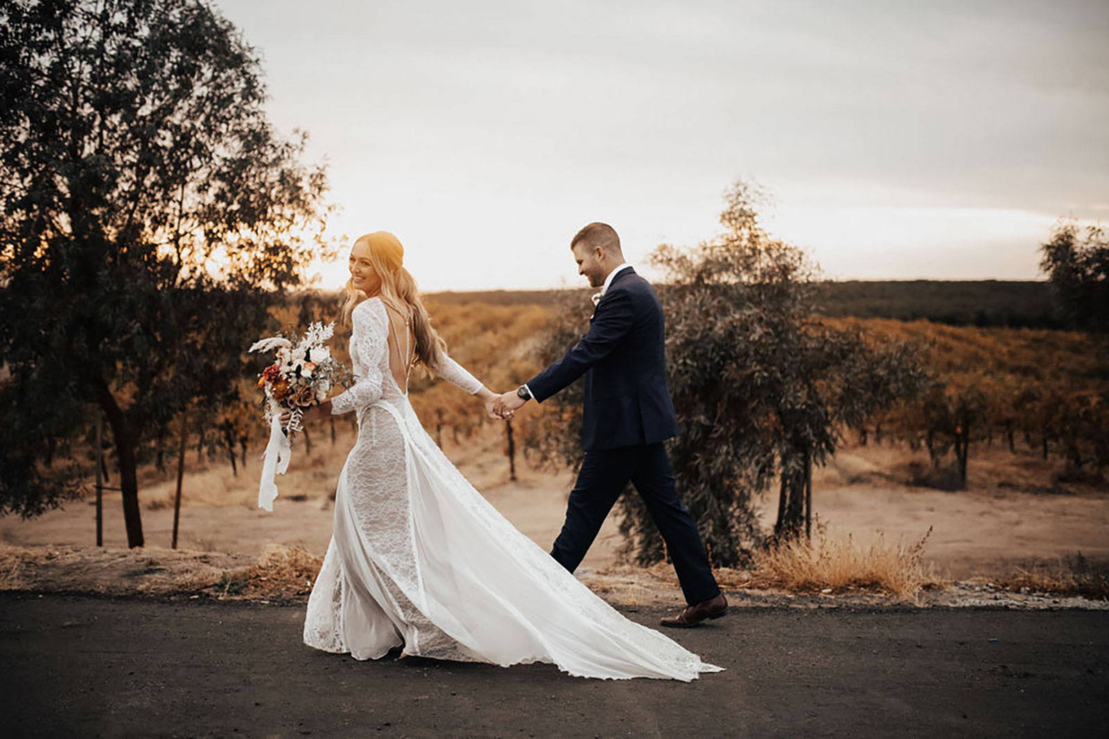 Bride and Groom holding hands