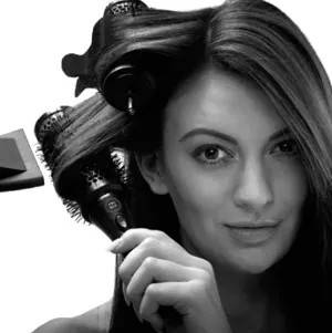 Girl drying hair with curlers