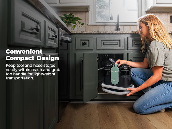 Woman organizing tools under a kitchen sink with compact design features.