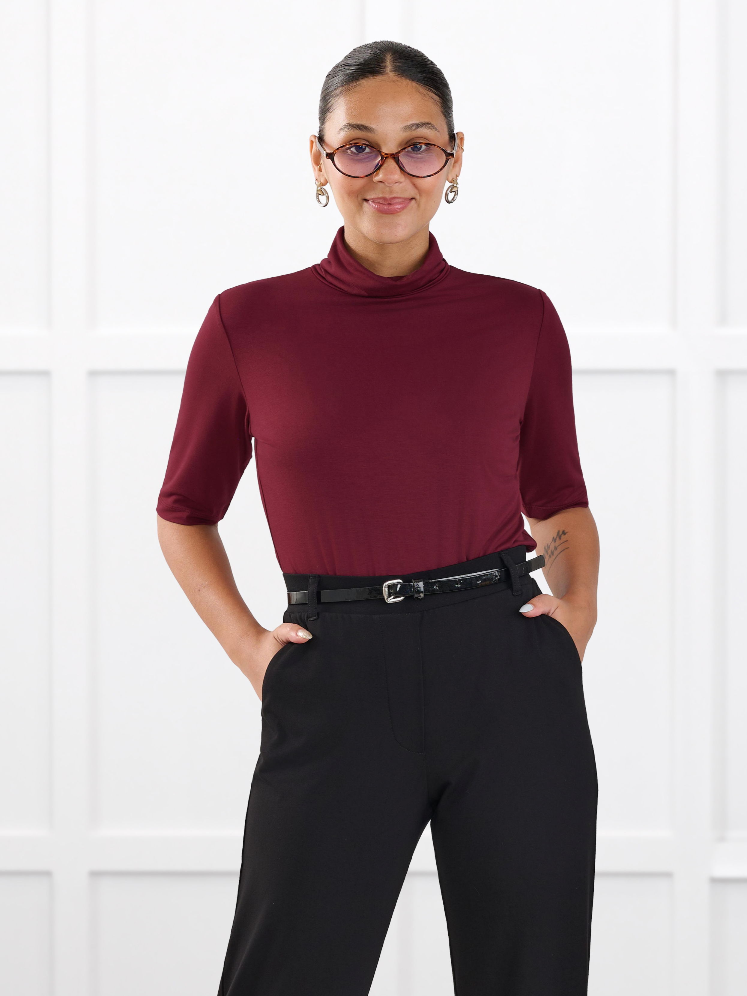 Woman wearing Miik's halima half sleeve top in merlot