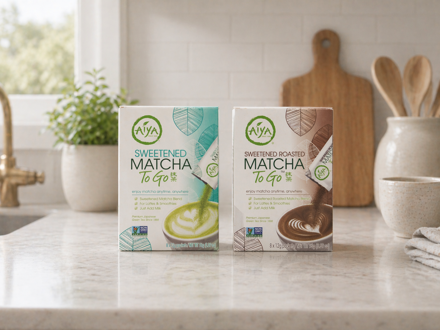 Two boxes, Sweetened Matcha To Go and Sweetened Roasted Matcha To Go, on a kitchen countertop.