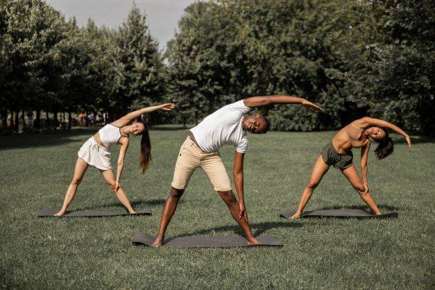 People Stretching In The Park