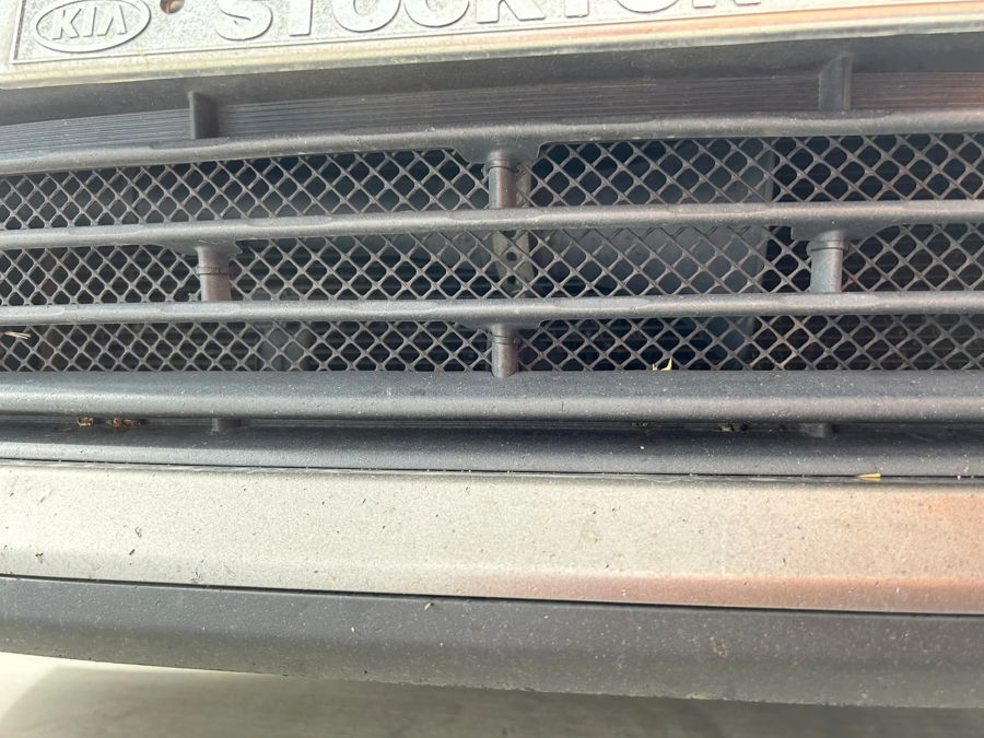 Front lower grille and bumper close-up on Jeff's 2016 Kia Optima with Stockton Kia license plate frame photo 2