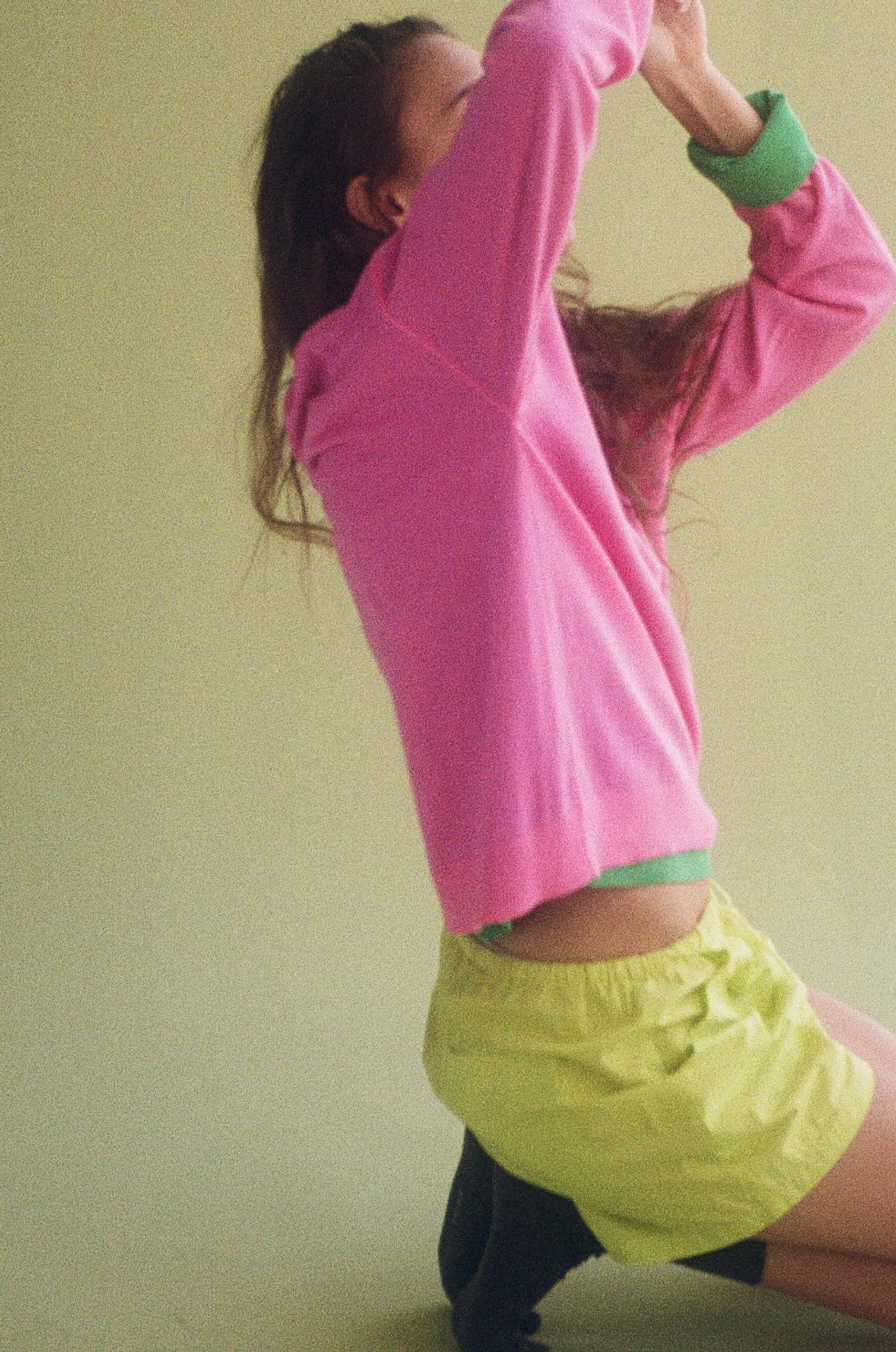 Woman on ground with arm above head
