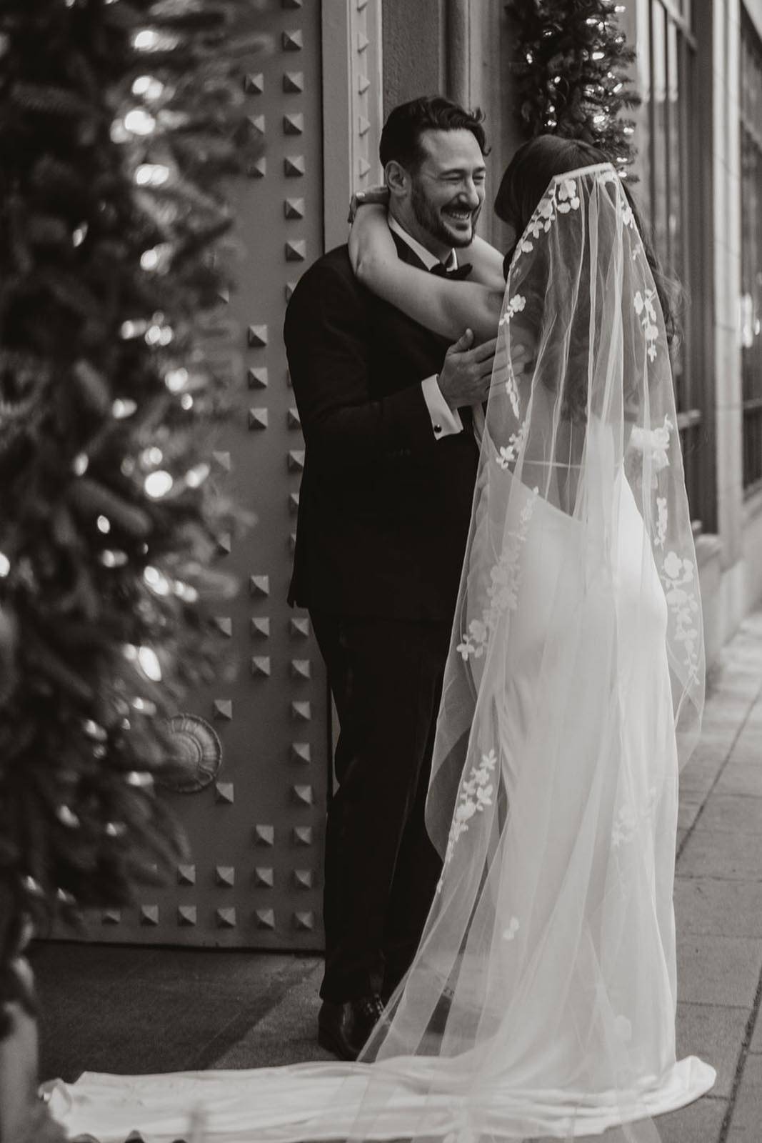 Bride and groom holding each other