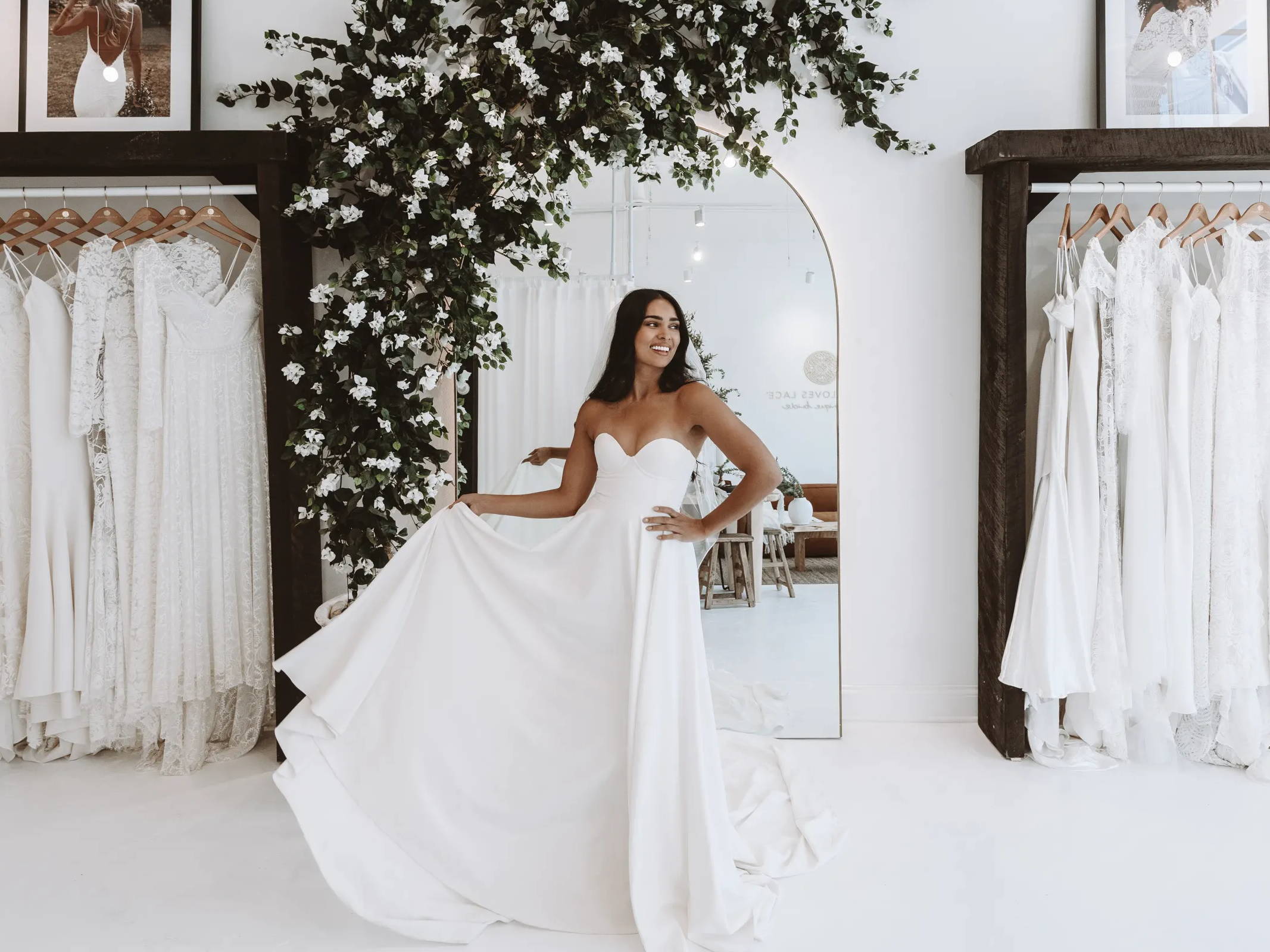 Bride trying on dresses in the United States Grace Loves Lace showroom