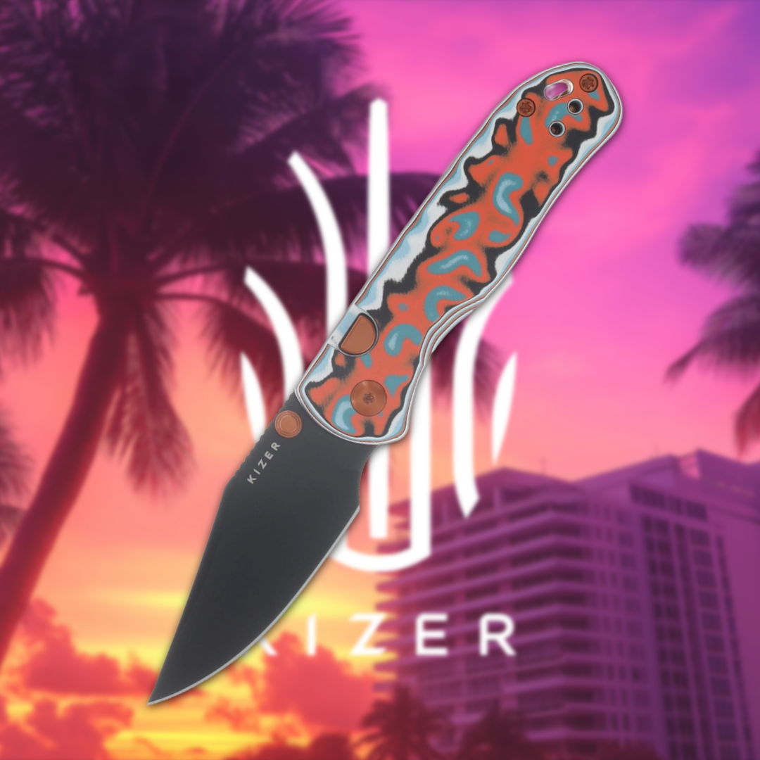 A colorful folding knife in front of a sunset background.