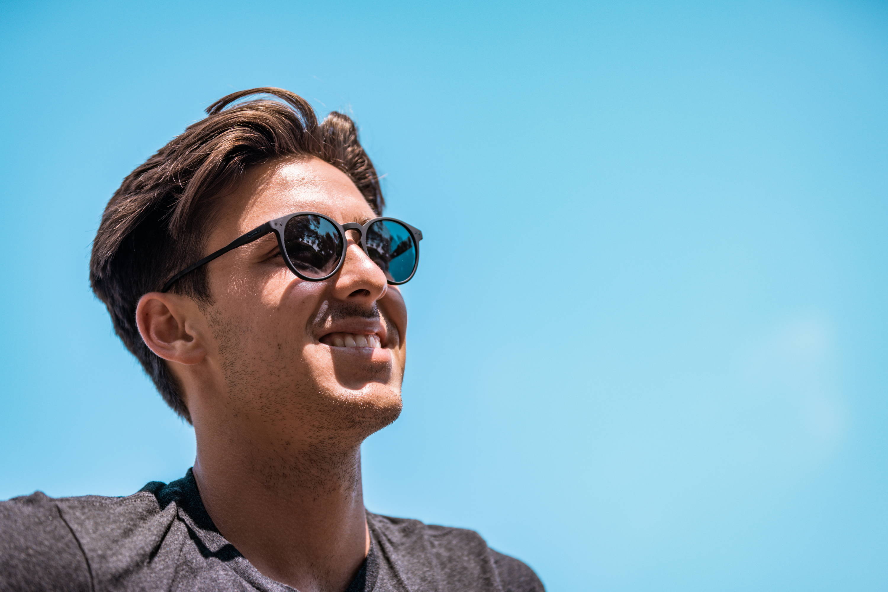 Man wearing black sunglasses on a sunny day