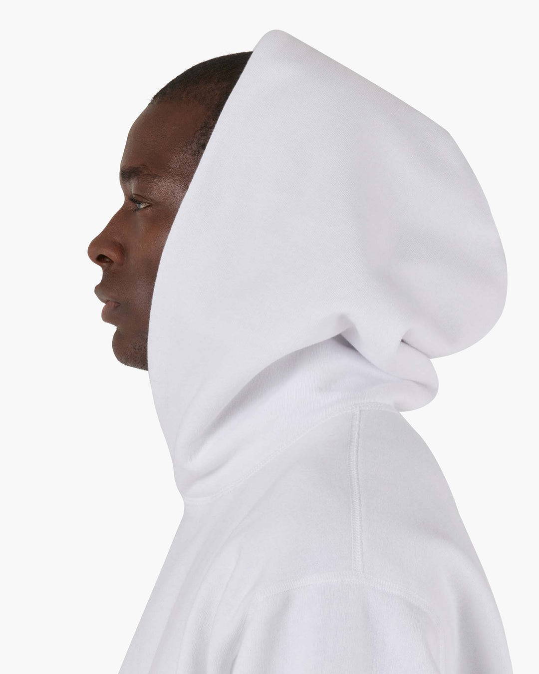 model in white hoodie profile