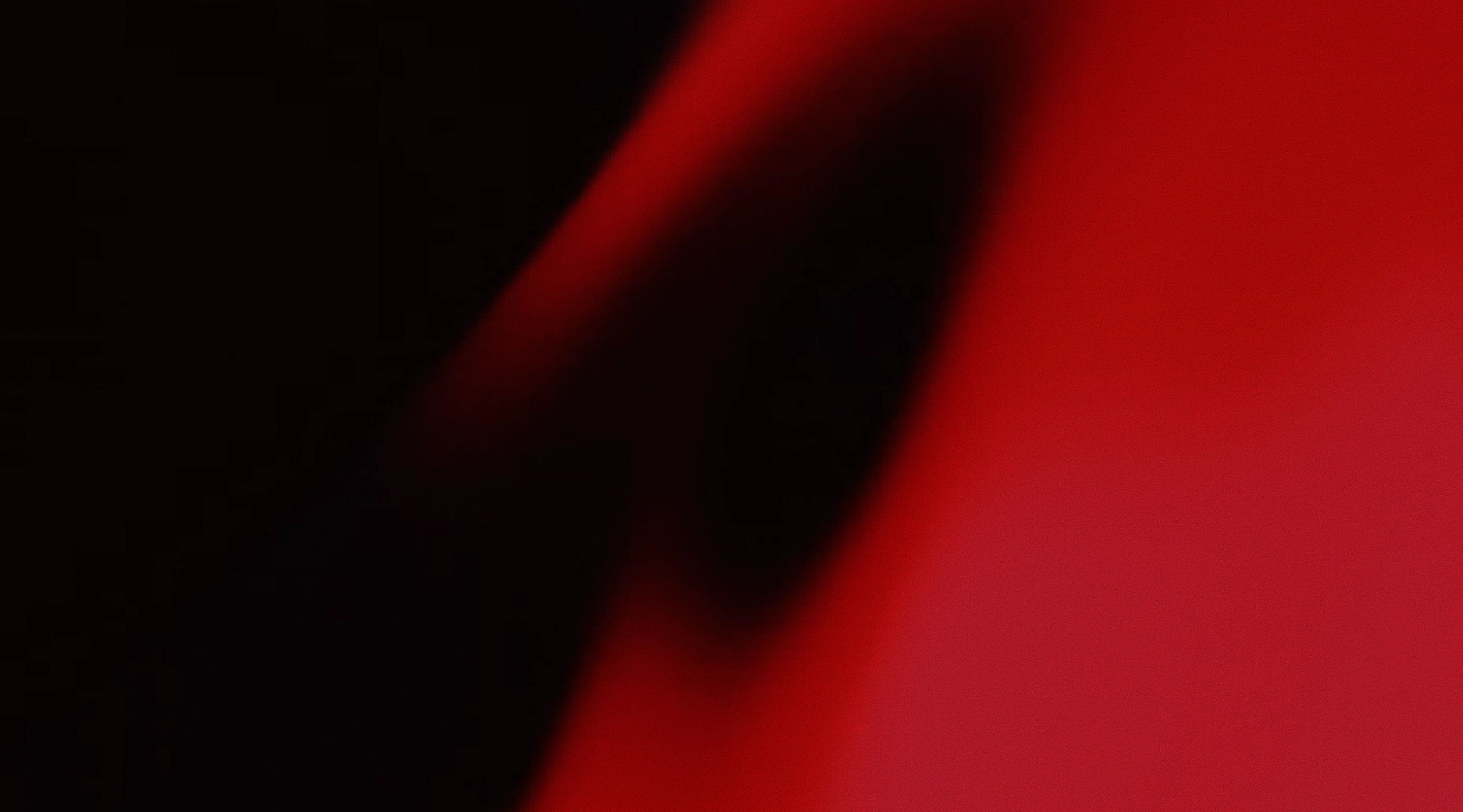 Abstract red and black shapes with soft shadows and gradients.