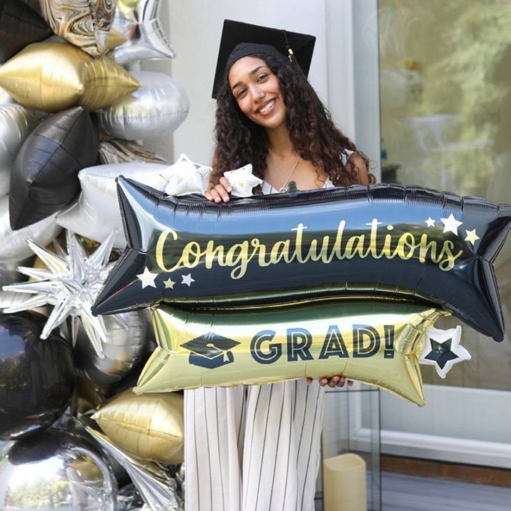 Person holding congratulations grad balloon. Shop all graduation balloons.