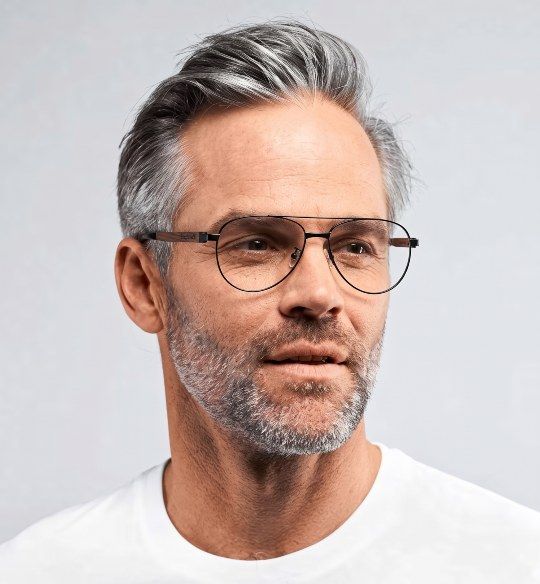 Man with grey hair wearing Purpose Black aviator glasses