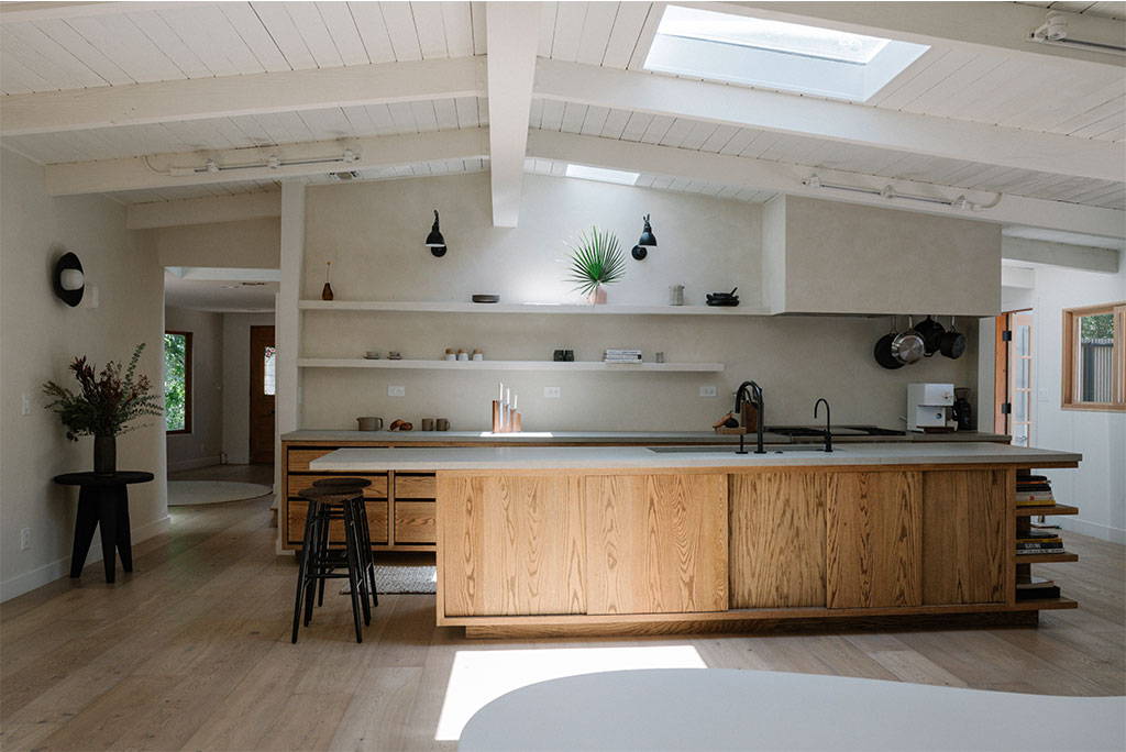 Open plan kitchen with sunlight illuminating the room