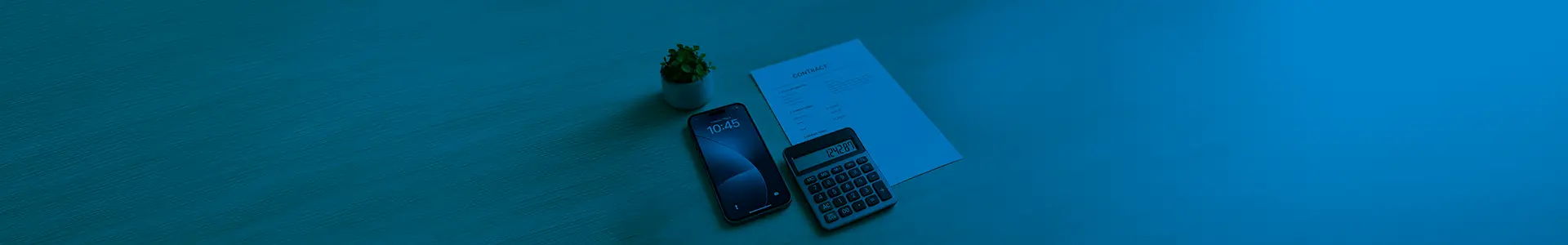 A phone, a notebook, and a pen on a blue surface.