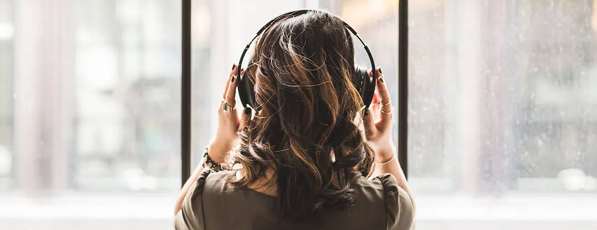 Woman listening to headphones