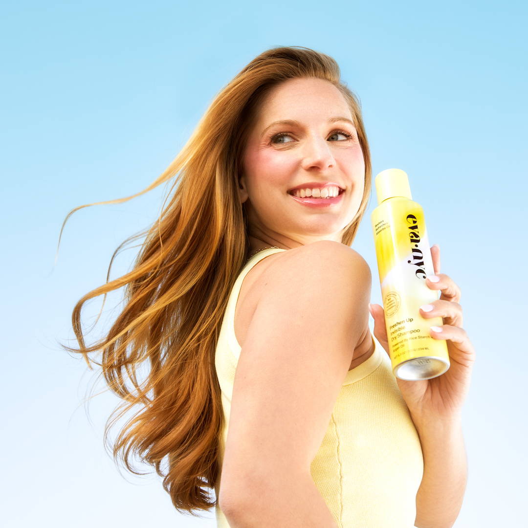 Model holding a dry shampoo