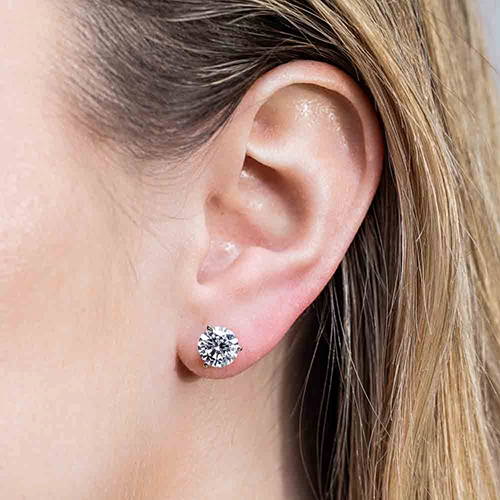 Woman wearing classic lab grown diamond martini stud earrings by MiaDonna
