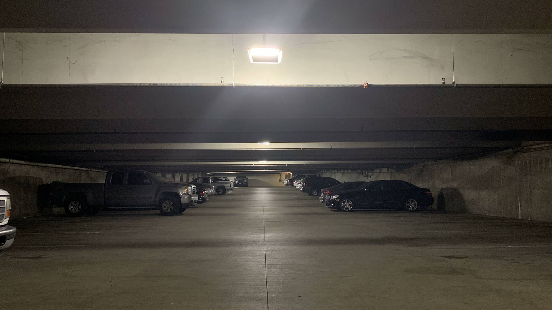 LED canopy lights installed in an indoor parking garage