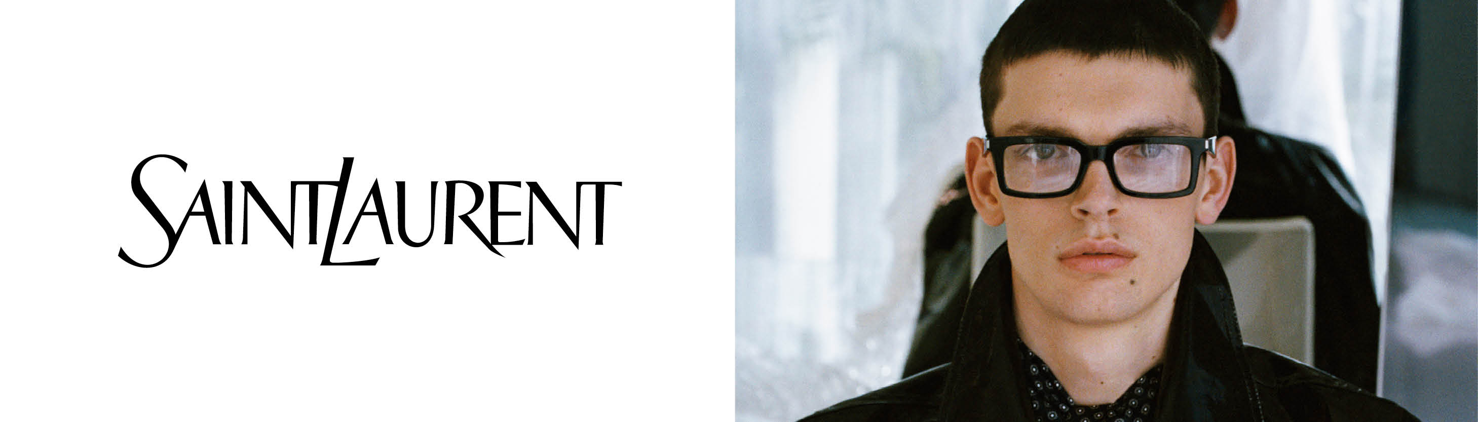 A model wearing glasses next to the Saint Laurent logo.