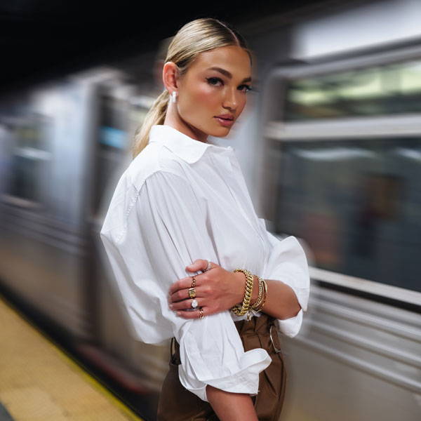 Model wearing Ring Concierge fine jewelry waiting for the subway