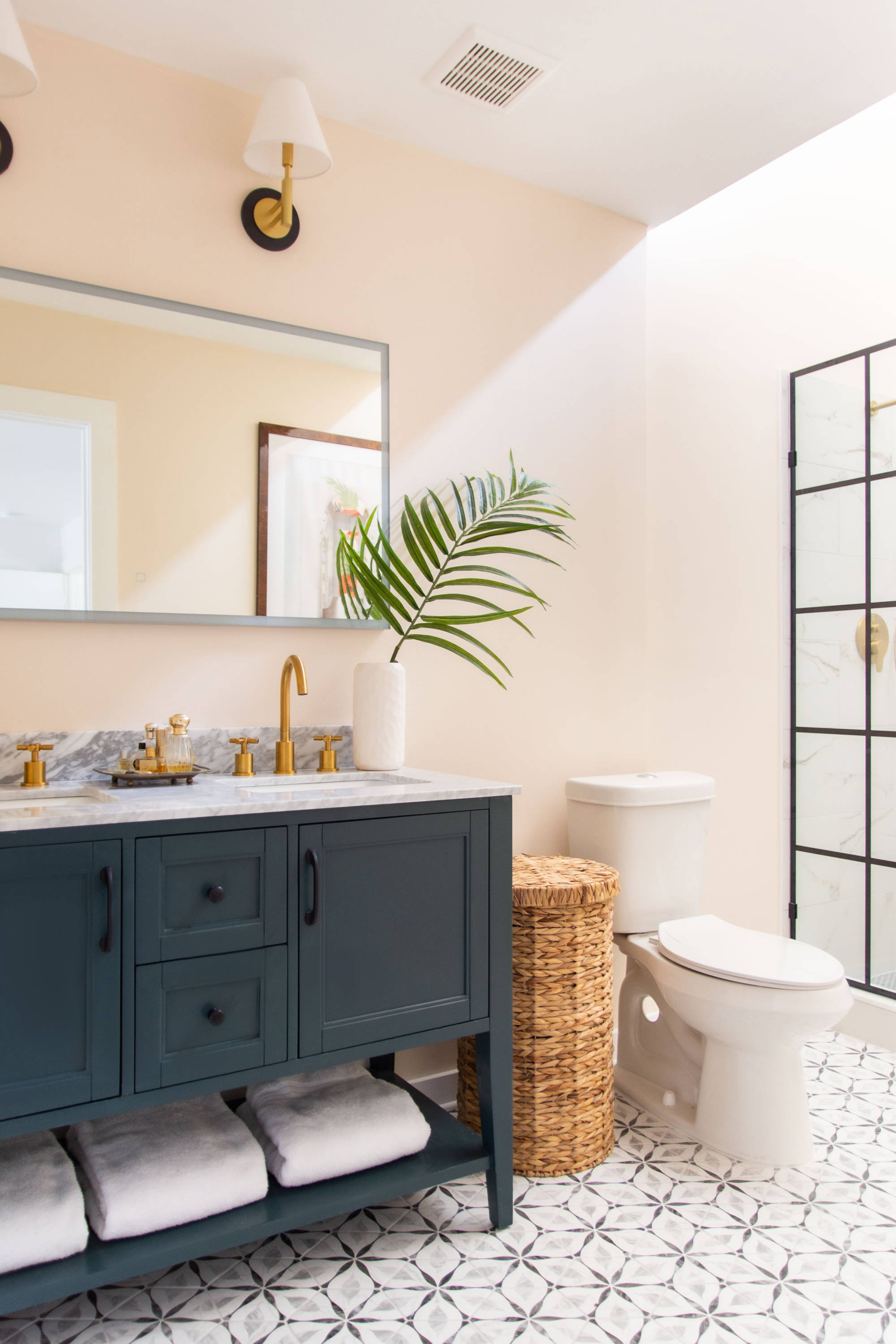 Bathroom renovation in Atlanta by Kevin Francis Design, green vanity, peach wall color, gold faucets, classic bathroom ideas