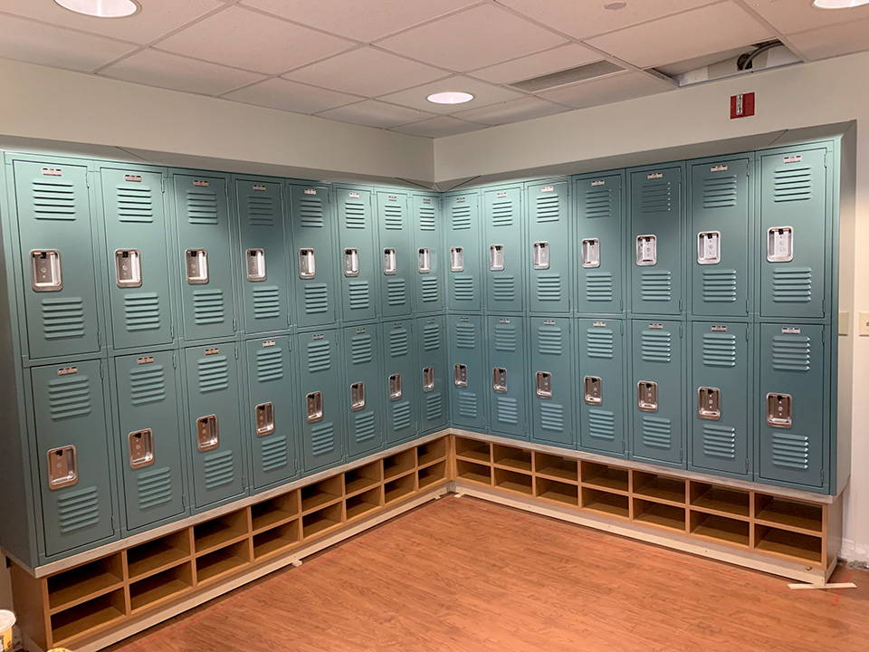 Lockers installed above shoe storage employee