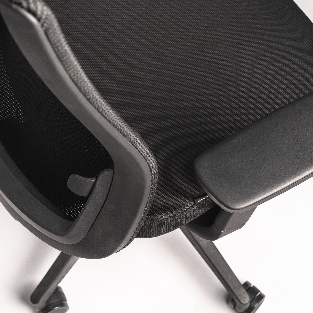 Black ergonomic office chair " Ergo above in a studio setting