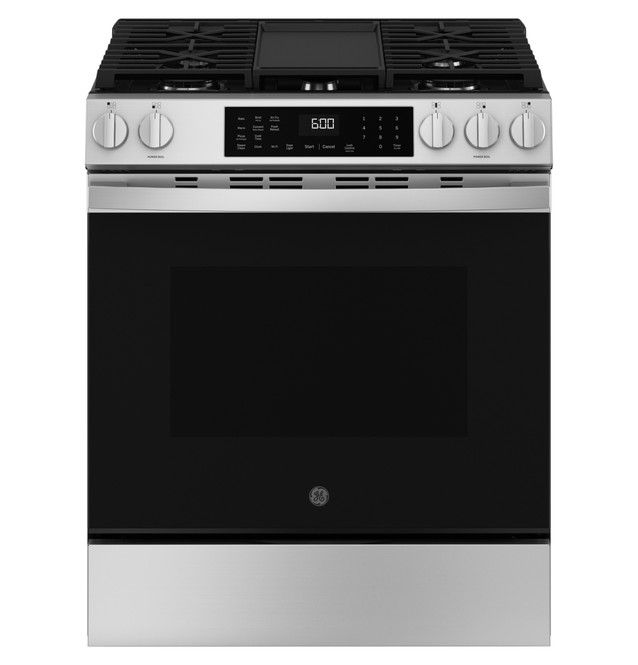 Stainless steel gas range with black oven and control panel.