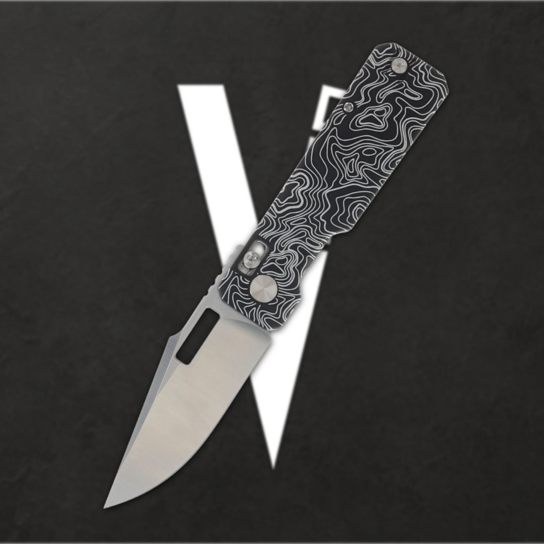 A folding knife with a patterned handle on a black background.