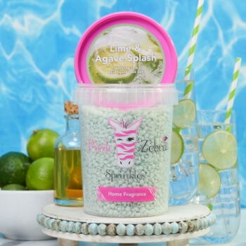 Container of bath salts with lime and green accents, set against a blue background.
