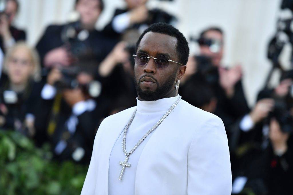 diddy in a white suit