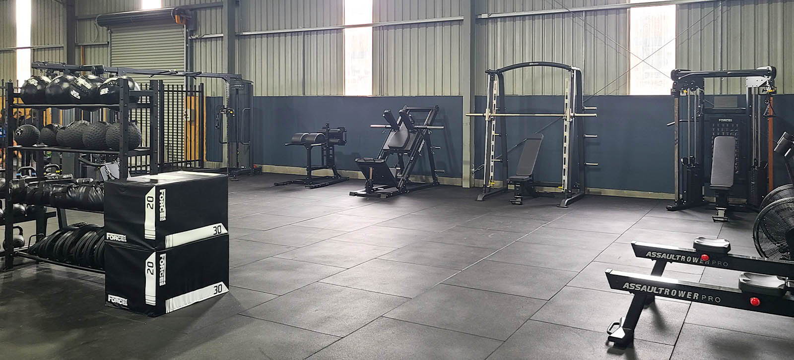 High School Gym Fit Out at Monaro School showcasing a variety of strength training machines and power racks for student athletes.