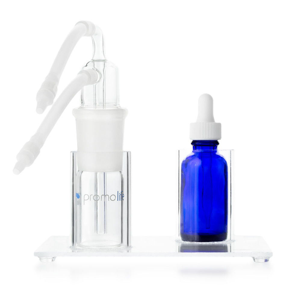 A clear stand with a dropper and a blue glass bottle.