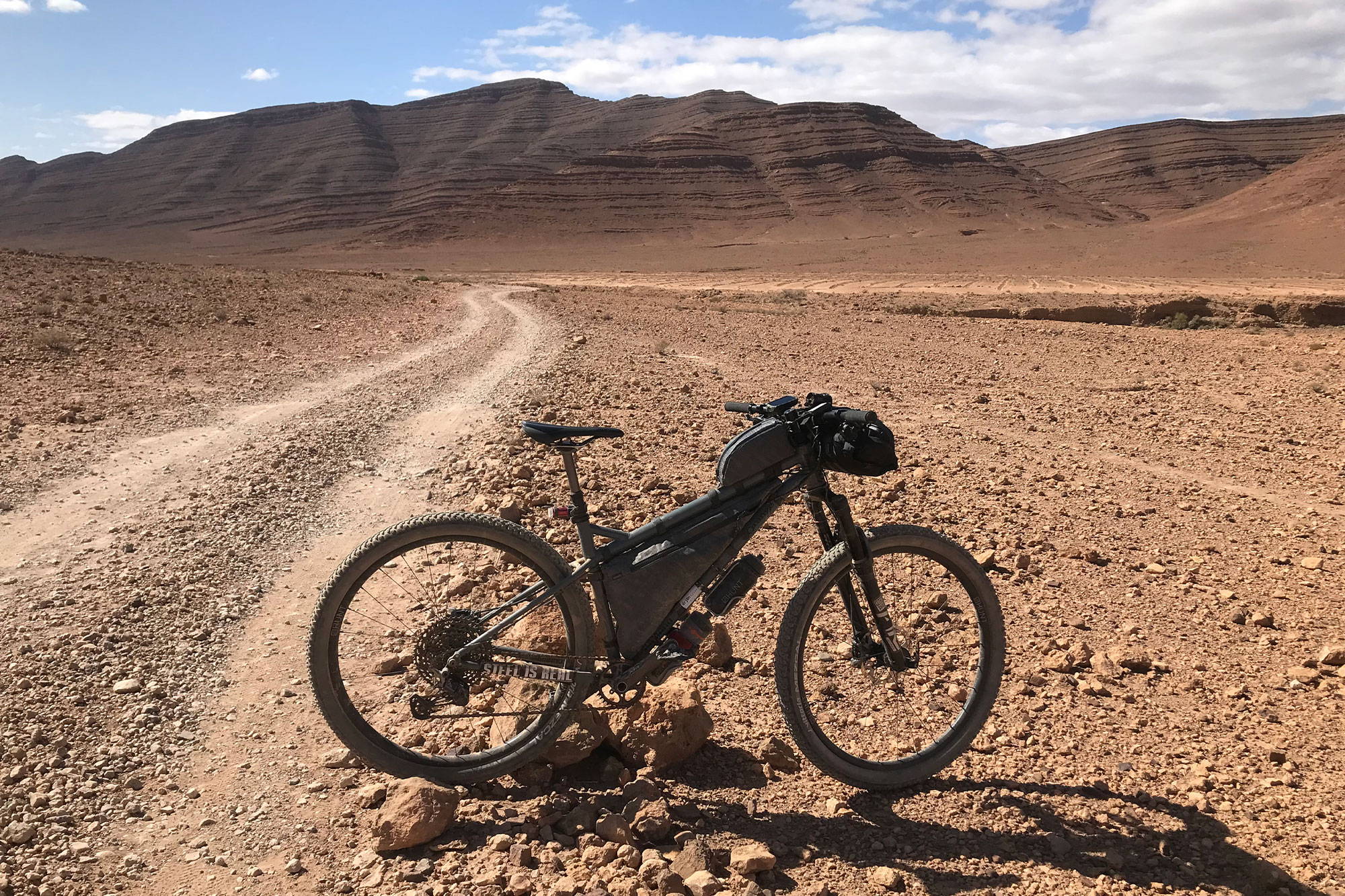 Rich's bike in front of mountains