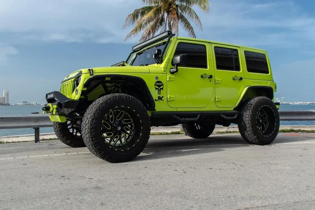 Side profile Omar's 2016 Jeep Wrangler wheels tires Jeep SUV exterior Shocker XL train horn gallery photo 2