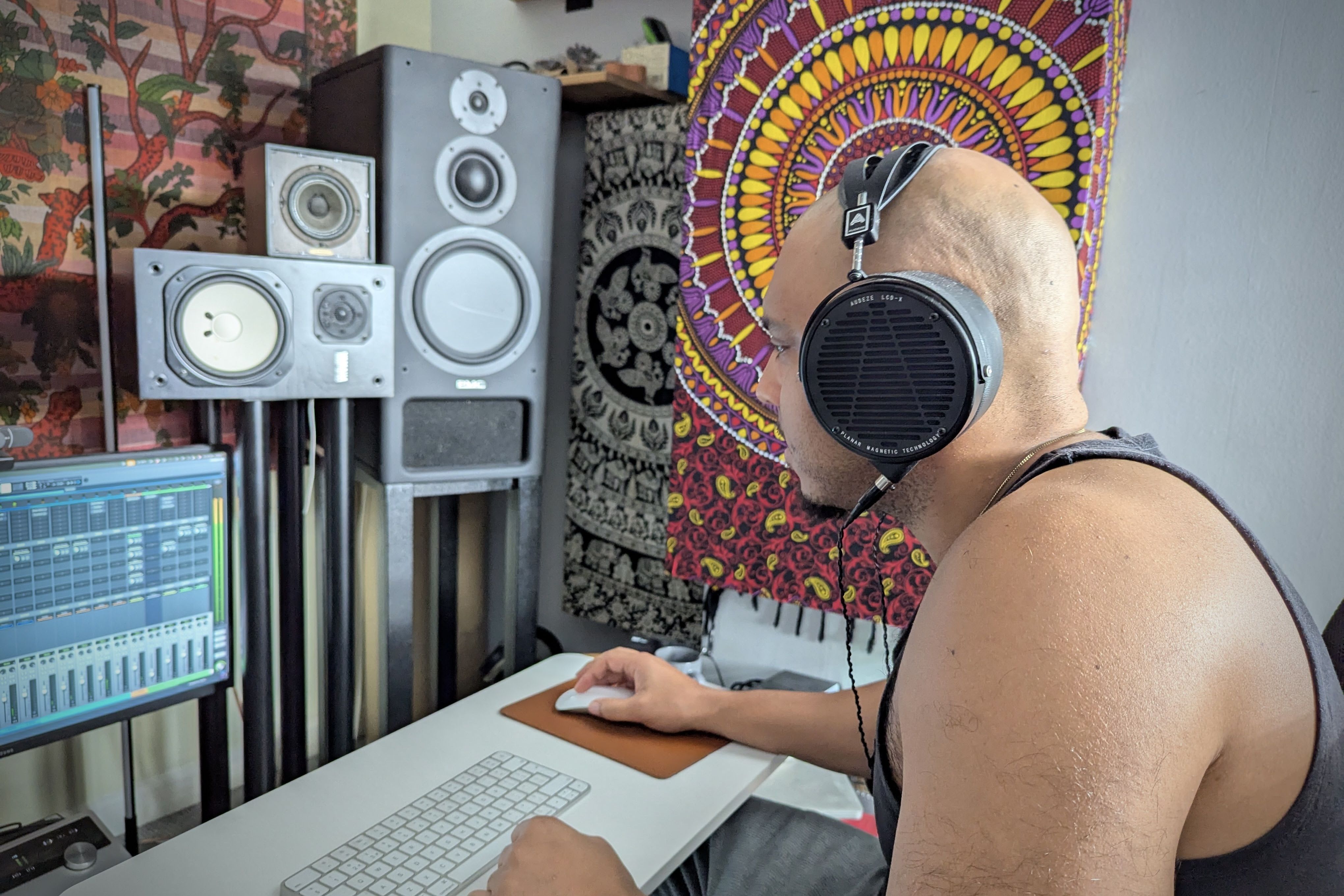 Clinton McCreery wearing Audeze LCD-X headphones in the studio 
